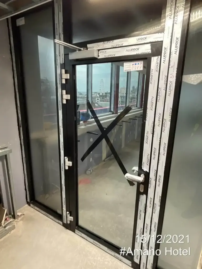 FD30 fire door in sleek white finish installed in hotel corridor